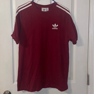 Maroon Adidas t-shirt.